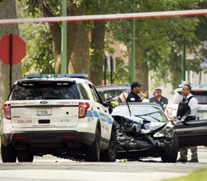 Chicago police investigate a police-involved fatal shooting in the 7300 block of South Merrill Avenue in Chicago's South Shore neighborhood on Friday, July 29, 2016.