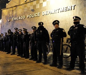 In this Nov. 24, 2015, file photo, Chicago police officers line up outside the District 1 central headquarters in Chicago. (AP Photo/Paul Beaty File)