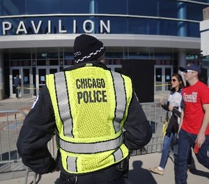 A Chicago police officer stands his post outside the University of Illinois-Chicago Pavilion, Friday, March 11, 2016, in Chicago.