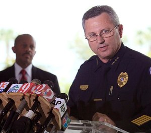 In this March 22, 2012 file photo, Sanford Police Chief Bill Lee speaks to the the media during a news conference as city manager Norton Bonaparte Jr. listens at left, in Sanford Fla.