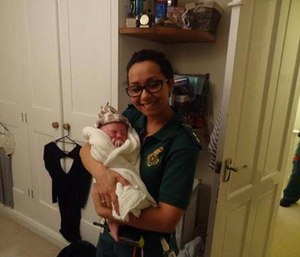 Paramedic Chloe Civil holds newborn Holly Chloe.