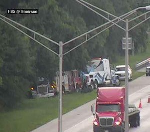 A Florida Department of Transportation camera captured images of a Jacksonville fire engine being towed after overturning on the side of the highway.