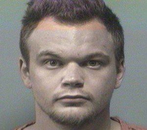Allen Dwight Horton, 23, is accused of taking a Columbiana police officer gun and trying to shoot the officer with it. Horton also allegedly punched a paramedic in the face, knocking the medic to the ground.