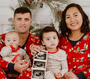 Police officer Matthew Cheek, his wife and their sons.