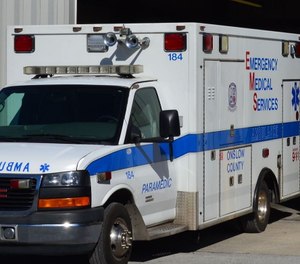 An Onslow County EMS ambulance caught fire Tuesday morning, causing one paramedic to suffer smoke inhalation.