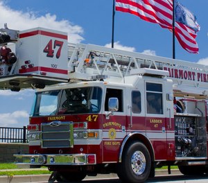 A Fairmont firefighter was burned trying to save a man during a house fire on Wednesday.