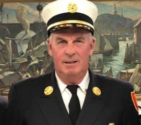The Rockport Board of Selectmen voted to terminate Fire Chief James Doyle amid an ongoing dispute between volunteer firefighters and town officials, including a lawsuit filed by 11 Rockport residents against the town.