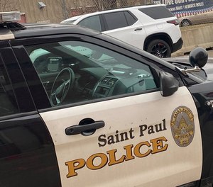 St. Paul police say two teenagers crashed a stolen SUV into an ambulance while being pursued by officers.