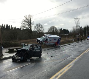 A vehicle collided with an AMR ambulance in Clark County, Washington, on Tuesday, injuring two paramedics and killing the other driver, officials said. (Photo/Clark County Sheriff's Office)