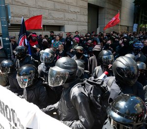 Multiple groups, including Rose City Antifa, the Proud Boys and conservative activist Haley Adams protest in downtown Portland, Ore., Saturday, June 29, 2019.