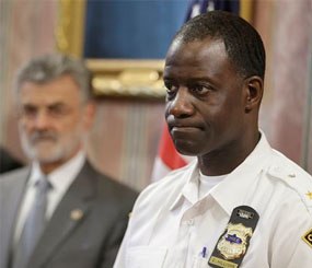 Cleveland Police Chief Calvin D. Williams, right, makes a statement regarding the grand jury announcement of the deaths of Timothy Russell and Malissa Williams Friday, May 30.