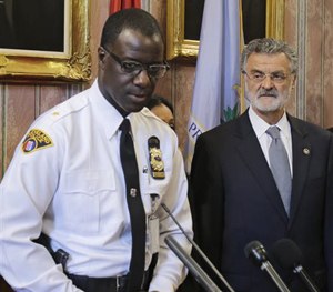 Cleveland Police Chief Calvin Williams, left, speaks at a news conference, Tuesday, May 26, 2015.