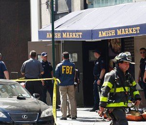 Emergency personnel work in lower Manhattan after a carbon monoxide leak.
