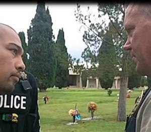 This Sept. 16, 2014 photo provided by the Cottonwwood, Ariz., Police Department shows Cecilio Cruz, left, and Cottonwood, Ariz., police Sgt. Tod Moore at a funeral home and cemetery in Tucson, Ariz., on Tuesday, Sept. 16, 2014. (AP Image)