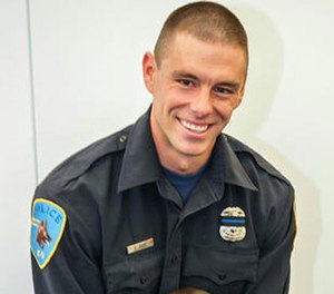This undated photo provided by Wayne State University shows university police officer Collin Rose.