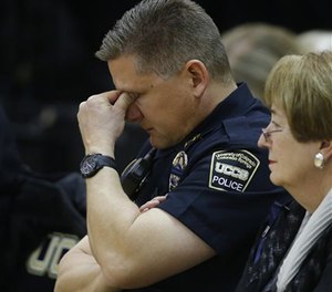 Brian McPike, the chief of the University of Colorado-Colorado Springs police force, attends a vigil on campus, Nov. 28, 2015.
