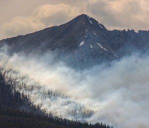 In this July 5, 2017, file photo, a wildfire burns near Breckenridge, Colo.
