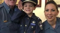 Colo. city's 'youngest officer' celebrates end of chemo with family, fellow cops
