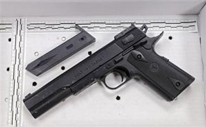 In a Wednesday, Nov. 26, 2014 file photo, a fake handgun taken from 12-year-old Tamir Rice, who was fatally shot by Cleveland police, is displayed after a news conference in Cleveland. The 12-year-old was shot at a city park after he reportedly pulled the Colt 1911 replica on arriving officers. Two fatal police shootings in less than four months of young people holding lookalike guns in Ohio have raised calls for action to prevent such tragedies.