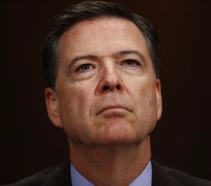 In this May 3, 2017, file photo, FBI Director James Comey listens on Capitol Hill in Washington. President Donald Trump has fired Comey. In a statement on Tuesday, May 9, Trump says Comey’s firing “will mark a new beginning” for the FBI. (AP Photo/Carolyn Kaster, File)