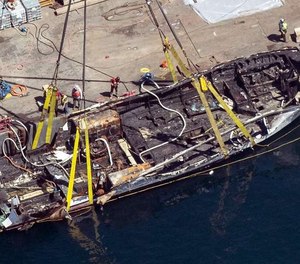 In this Sept. 12, 2019, photo, the burned hull of the dive boat Conception is brought to the surface by a salvage team off Santa Cruz Island, Calif. The crew aboard the Southern California scuba dive boat had not been trained on emergency procedures before the deadly fire broke out last year, killing 34 people in one of the state's deadliest maritime disasters, according to federal documents released Wednesday.
