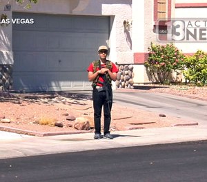 This Sept. 22, 2016, photo from video from KTNV 13 Action News shows Conor Climo during an interview while walking a Las Vegas neighborhood, heavily armed. (KTNV 13 Action News via AP)