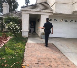 Officer McCarthy delivers a pizza in lieu of the delivery driver, whom his colleague had to arrest for an outstanding warrant.
