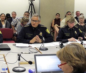 Honolulu Police Chief Louis Kealoha, center, addresses Hawaii lawmakers during hearing in Honolulu. (Photo/AP)