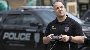 Police Sgt. Christian Rodriguez operates a drone at Hubbard Park in Meriden, Connecticut, last month. Several police departments during the coronavirus outbreak mounted speakers on drones to alert the public to social distancing guidelines. Image: Dave Zajac/Record-Journal via AP