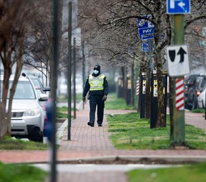 Police officers are struggling to serve and protect during the pandemic, some police chiefs say. (Photo/Getty Images)