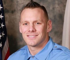 Firefighter James Axiotis saved the life of a police officer who had a heart attack while exercising at a gym.
