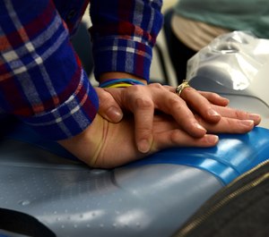 This photo shows CPR training at a U.S. airforce base. After both her parents died from heart attacks, a Utah student has proposed an idea for a device to supply artificial breaths during CPR. (Photo/U.S. Air Force, Airman 1st Class Destinee Dougherty)