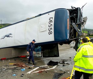 California Highway Patrol investigators examine the scene of a fatal Greyhound bus crash in San Jose, Calif. (AP Photo/Noah Berger)
