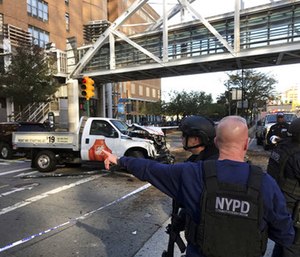 The rented Home Depot van drove onto a busy bicycle path and struck several people, then the driver emerged from the vehicle screaming. (Photo/AP)
