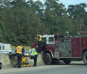 vintage fire truck crashed on Interstate 10 on Monday, coming to rest against a concrete wall on the Tchoutacabouffa River Bridge, police say. (Photo/Harrison County Police)