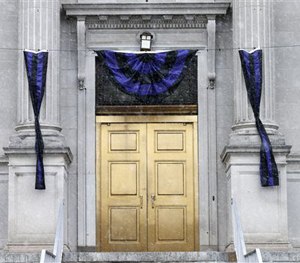 Memorial bunting adorns the entrance to City Hall in Linden, N.J. Friday, March 20, 2015.