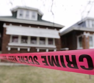 Crime scene tape surrounds a home Friday, Feb. 5, 2016, in Chicago.
