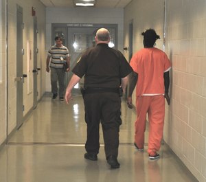 An inmate is transported through the halls of the Cumberland County Jail. Understaffing at the jail has led to an extremely limited intake of new inmates and prompted federal authorities to remove prisoners. (Photo Cumberland Sheriff's Office)