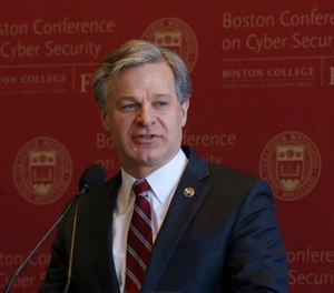 FBI Director Christopher Wray delivers the keynote address at a conference on cybersecurity on Wednesday, March 4, 2020, at Boston College.