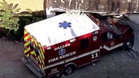 Stolen Dallas ambulance crashes into warehouse