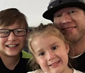 Damian Jay with his two children.