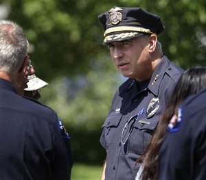 Aurora Police Chief Dan Oates talks to guests at the funeral for Aurora, Colo., movie theater shooting victim AJ Boik, Friday, July 27, 2012. (AP Image)