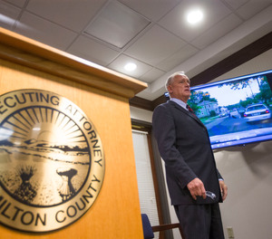 Ohio prosecutor Joe Deters explains a dash cam video during a news conference regarding the investigation into the shooting death of Cincinnati Police Department Officer Sonny Kim.