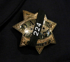 The badge of Davis Police Chief Darren Pytel is shown before funeral services for Davis Police Officer Natalie Corona at the University of California, Davis, Friday, Jan. 18, 2019, in Davis, Calif.