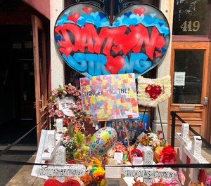 A makeshift memorial sits outside Ned Peppers nightclub in the Oregon District entertainment neighborhood where on Aug. 4 a gunman killed nine people, on Wednesday, Aug. 14, 2019, in Dayton Ohio. (AP Photo/Dan Sewell)