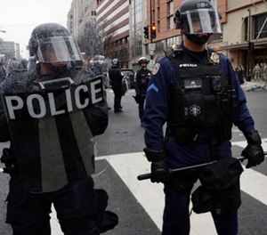 Police stand on K street as protesters try to disrupt the inauguration of President Donald Trump on Jan. 20, 2017 in Washington, D.C.