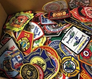 Lt. Jonathan Evans with MBFD said the department is donating hundreds of patches to Mileena that have been collected over the course of nearly 20 years. (Photo/ Myrtle Beach Fire Dept.)