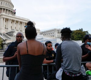 U.S. Capitol police officers talk with demonstrators as they have a conversation about racism in America as they protest the death of George Floyd, Wednesday, June 3, 2020, on Capitol Hill in Washington. (Photo/AP)