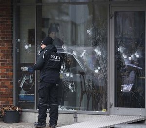 Police investigators work at the scene of Saturday's shooting at a free speech event in Copenhagen, Sunday, Feb. 15, 2015. (AP Image)
