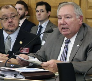 Kansas Senate Majority Leader Jim Denning (right) said state legislators will consider the merits of a mass inmate release to address the state's prison overcrowding issues. (Photo/AP)
